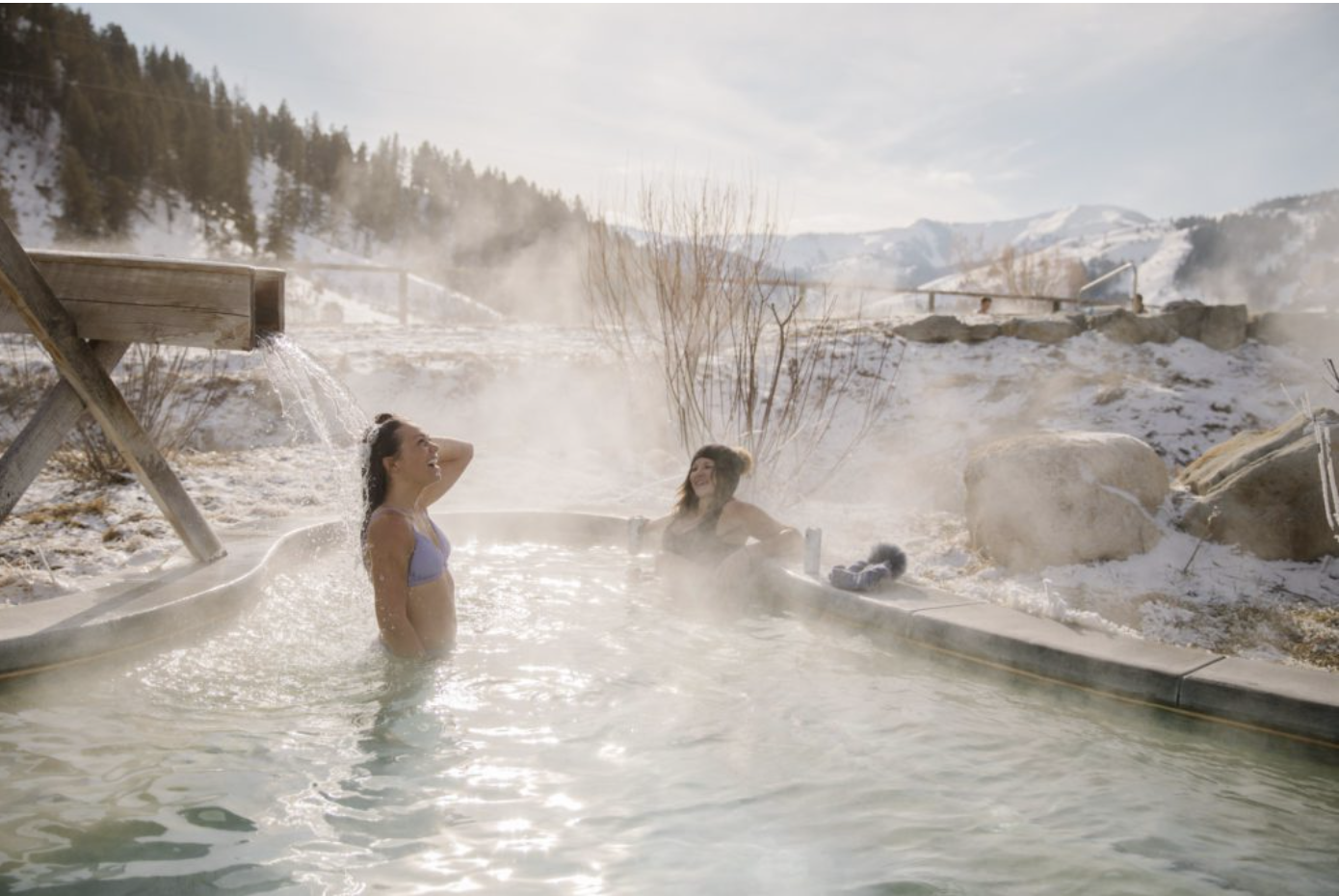 Two women in a hot springs pool.