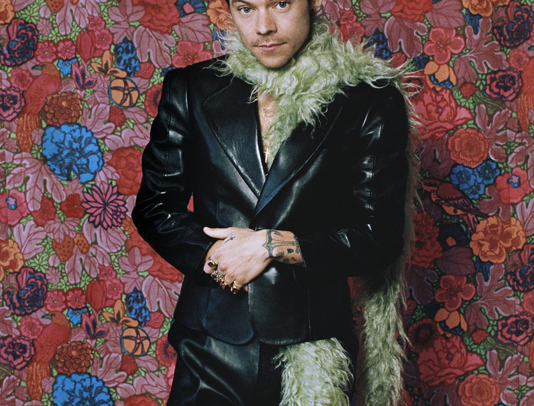 A close-up of Harry against a flowery backdrop