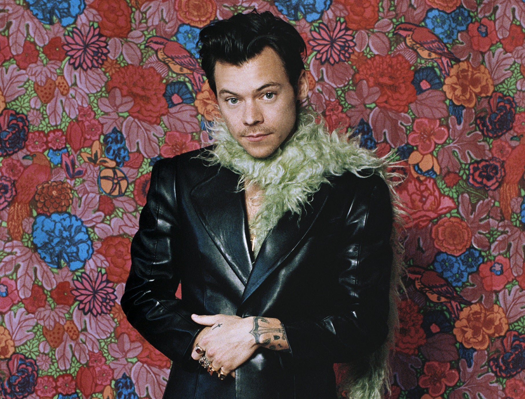 A close-up of Harry against a flowery backdrop