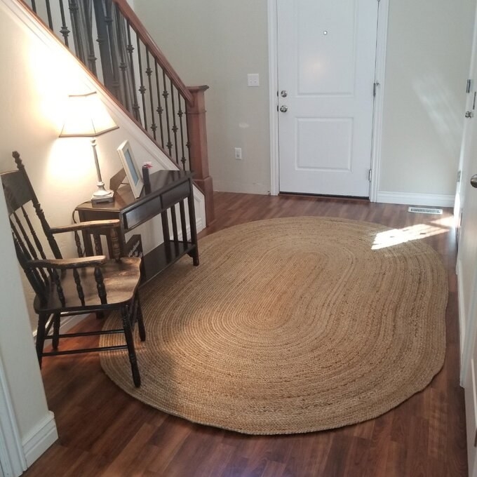 a reviewer photo of the jute rug
