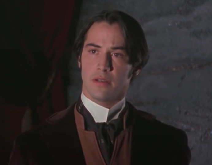 Keanu Reeves as Jonathan Harker talking to Dracula