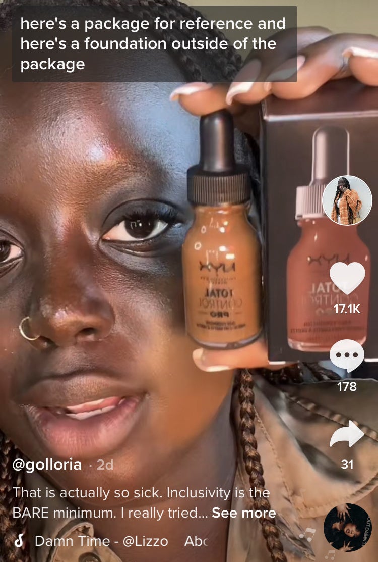 Golloria holding up a package showing a deceptively darker shade of makeup than the actual product