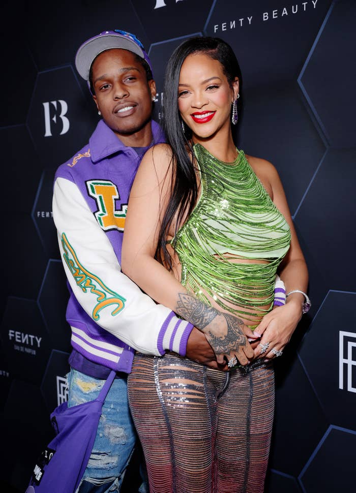 ASAP holding Rihanna from behind on the red carpet