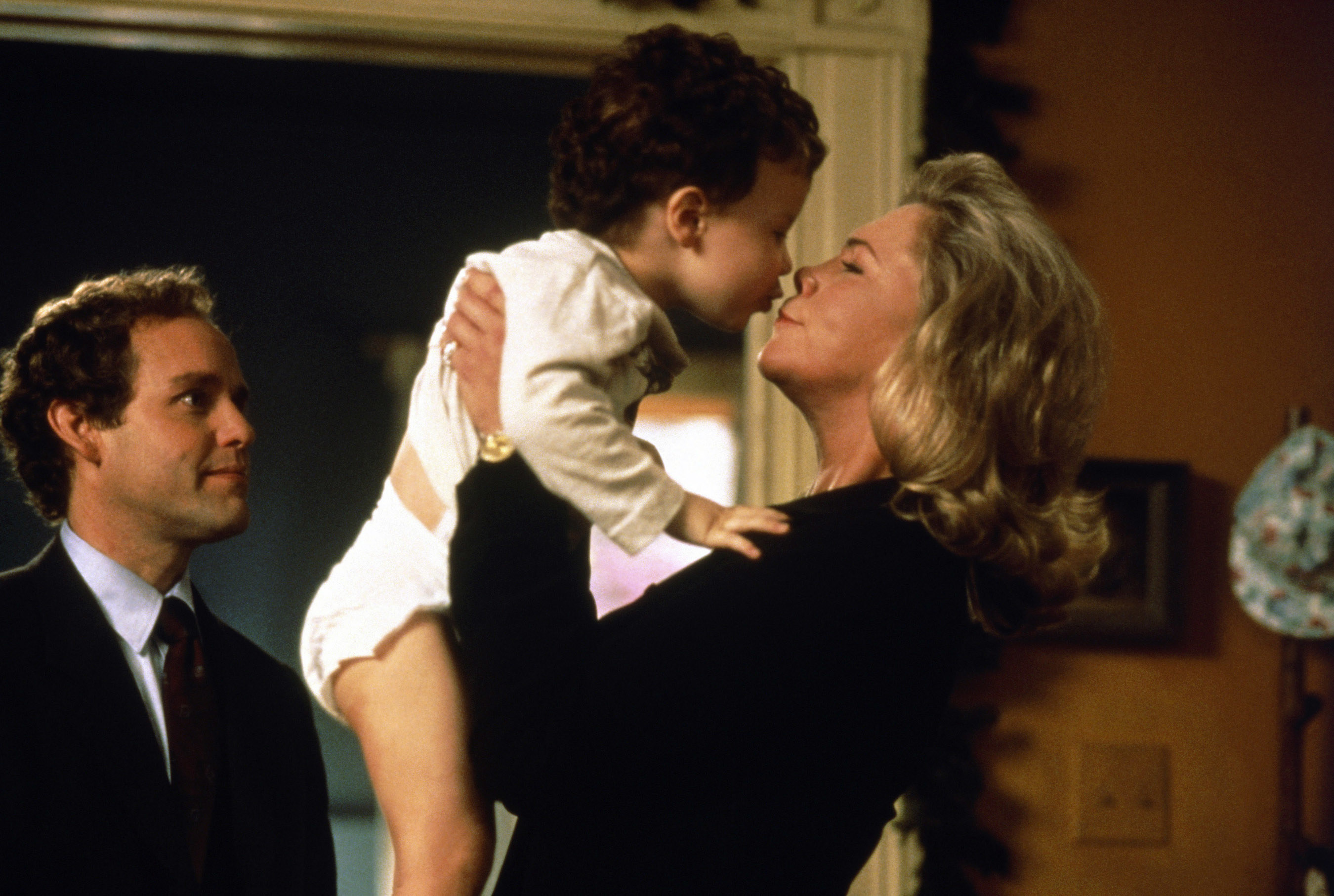 Peter MacNicol, Leo, Gerry, and Myles Fitzgerald, and Kathleen Turner in &quot;Baby Geniuses.&quot;