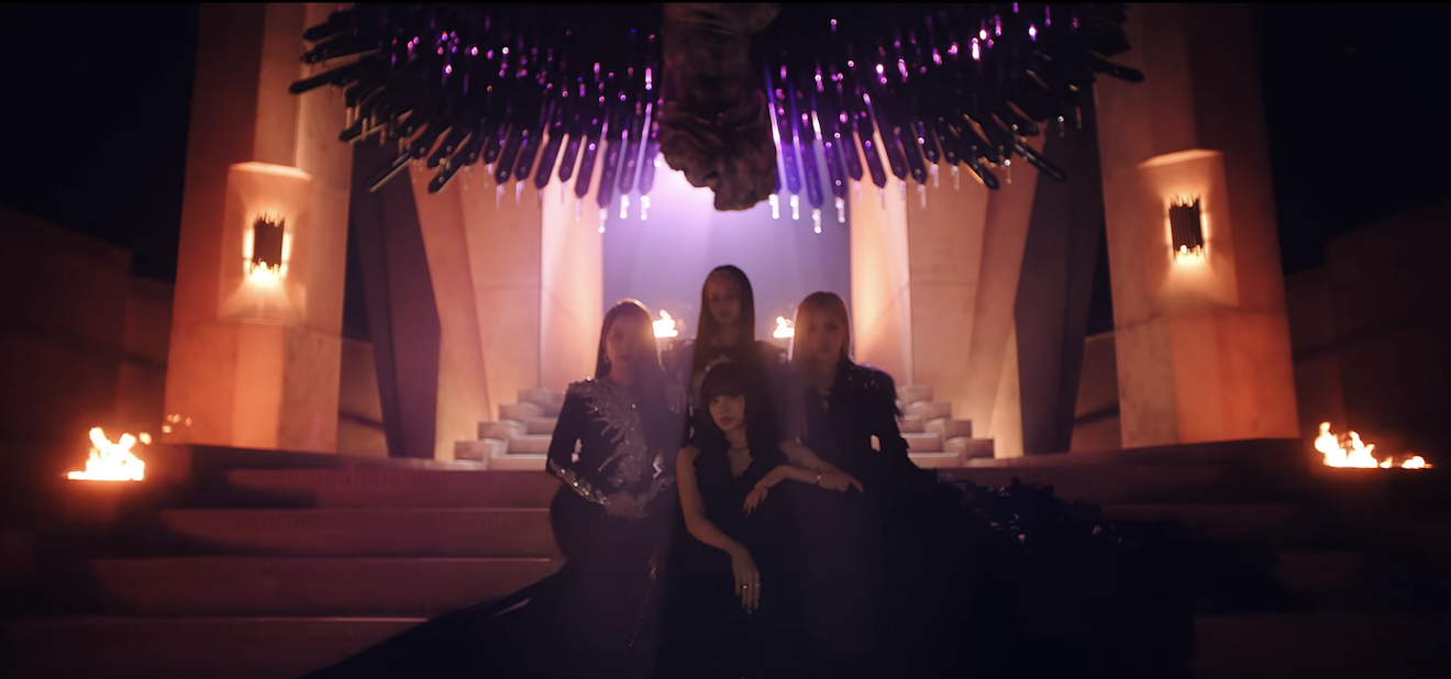 the members in a dark room for the video