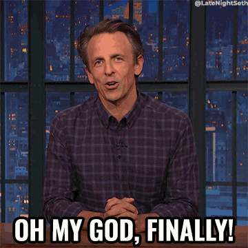 a gif of Seth Meyer sitting behind a desk and saying &quot;Oh my god, finally&quot;