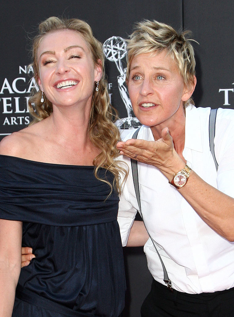 Ellen and Portia embracing each other on a red carpet
