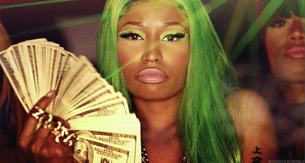 Cardi B holding a huge stash of $100 bills