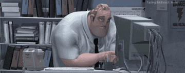 Animated character Bob Parr from The Incredibles working at a computer