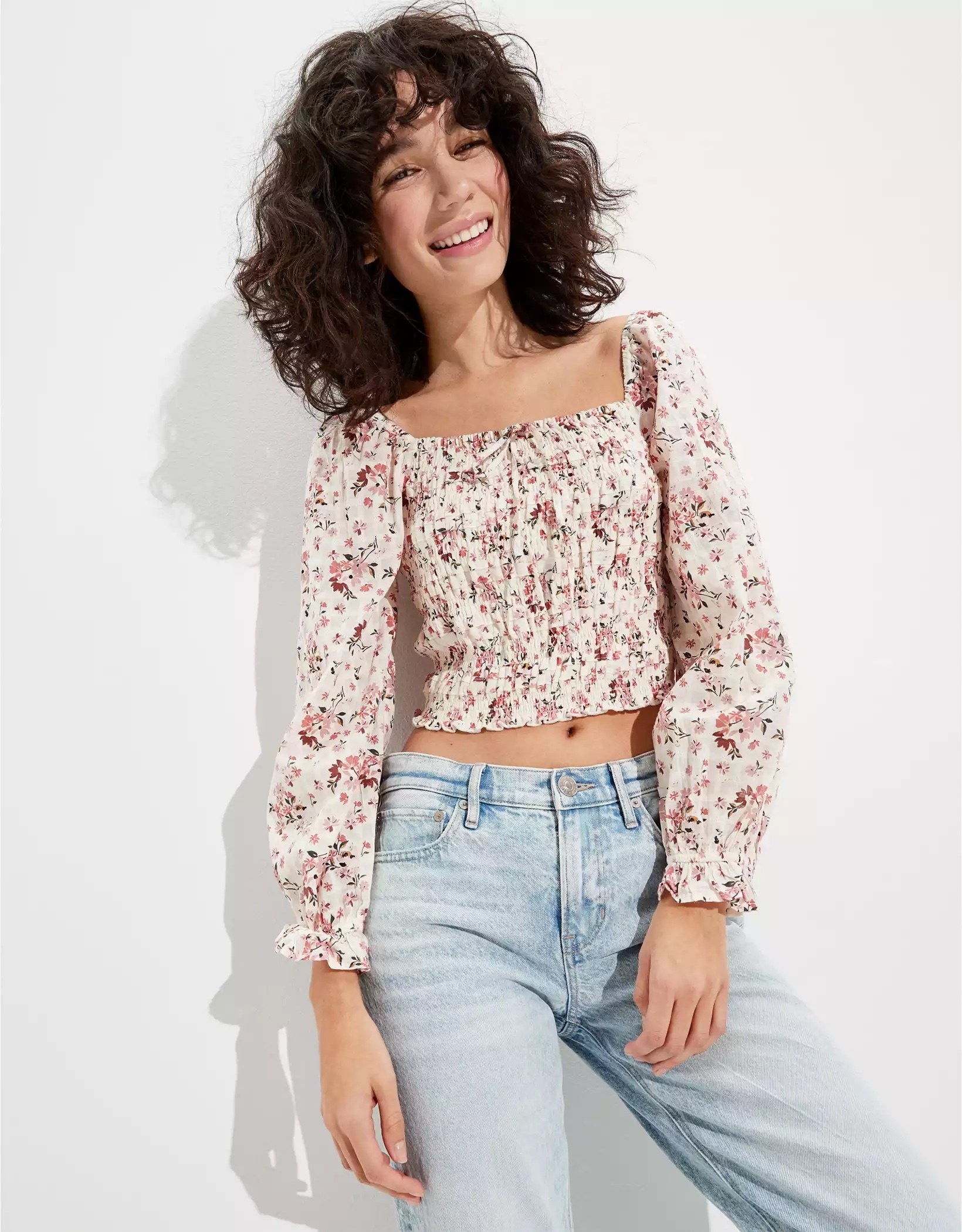 model wearing a floral print puff sleeved blouse