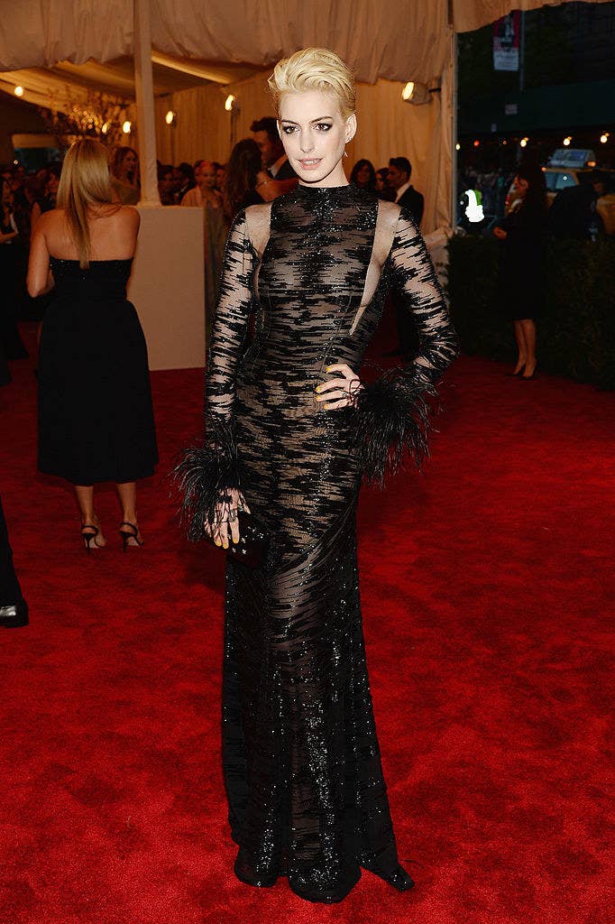 Anne wearing a sheer black gown