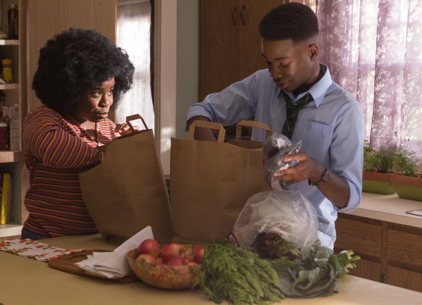 Uzo Aduba and Niles Fitch unpack groceries