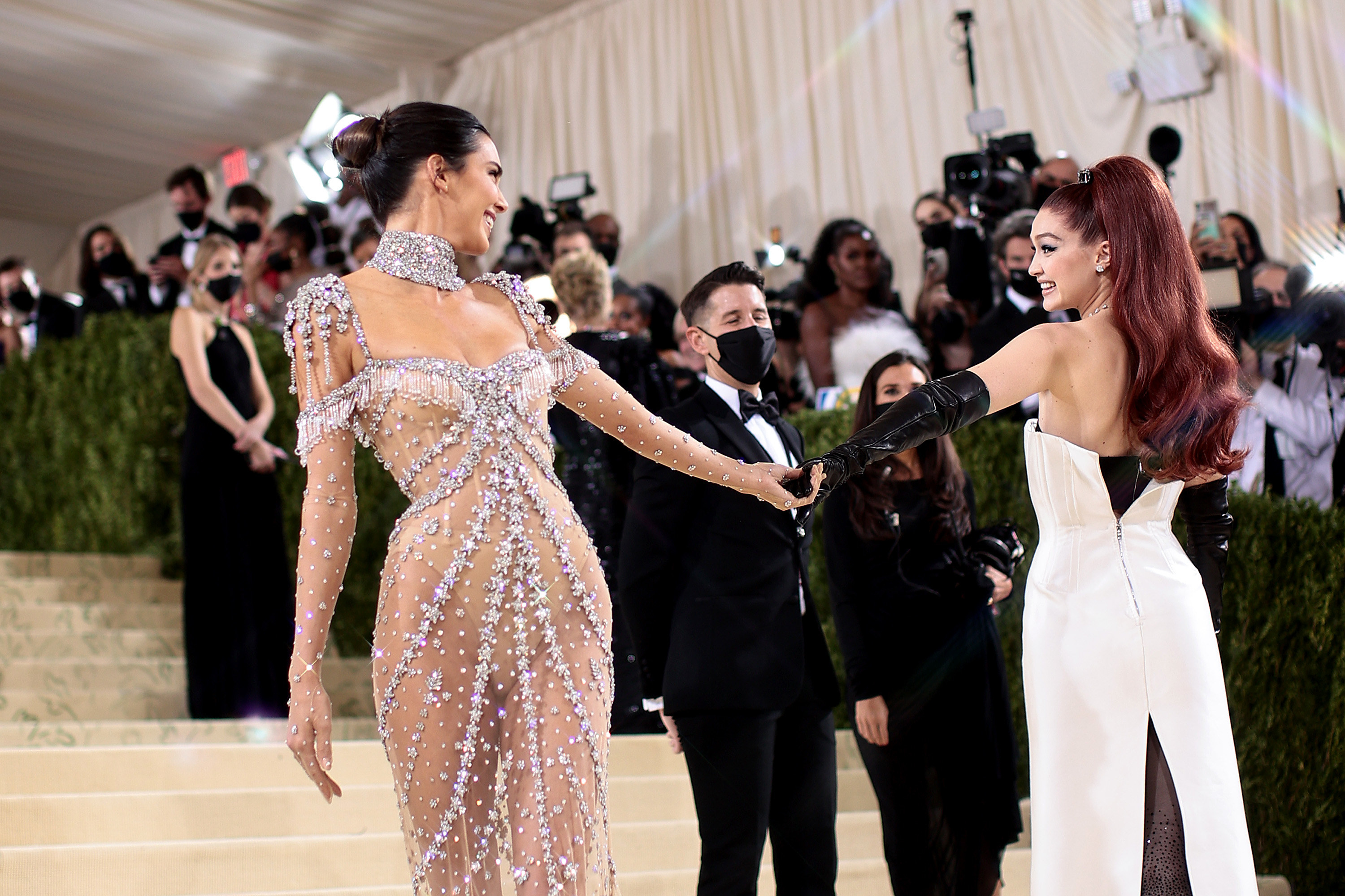 Kendall Jenner holding hands with Gigi Hadid on the Met Gala red carpet
