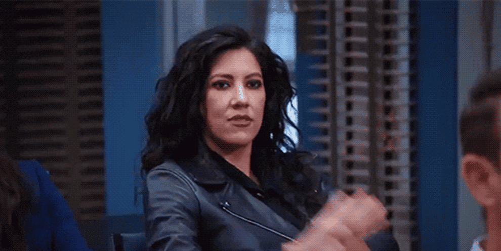 gif of rosa and amy high fiving in brooklyn 99