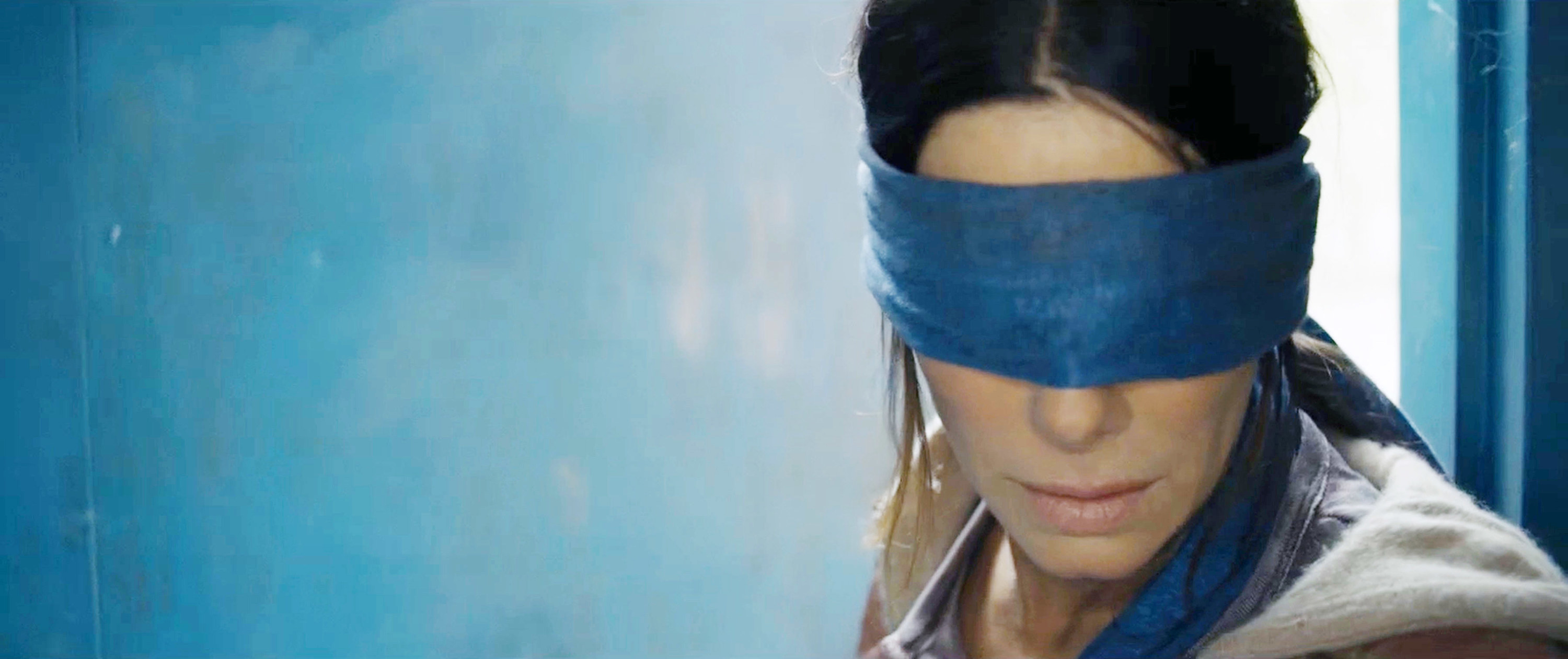a woman with a blindfold on
