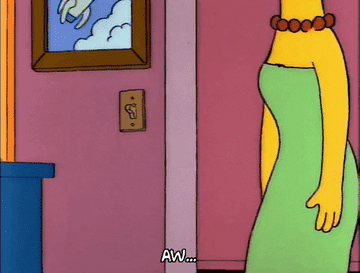 A gif of Marge hugging Bart saying &quot;aw&quot;