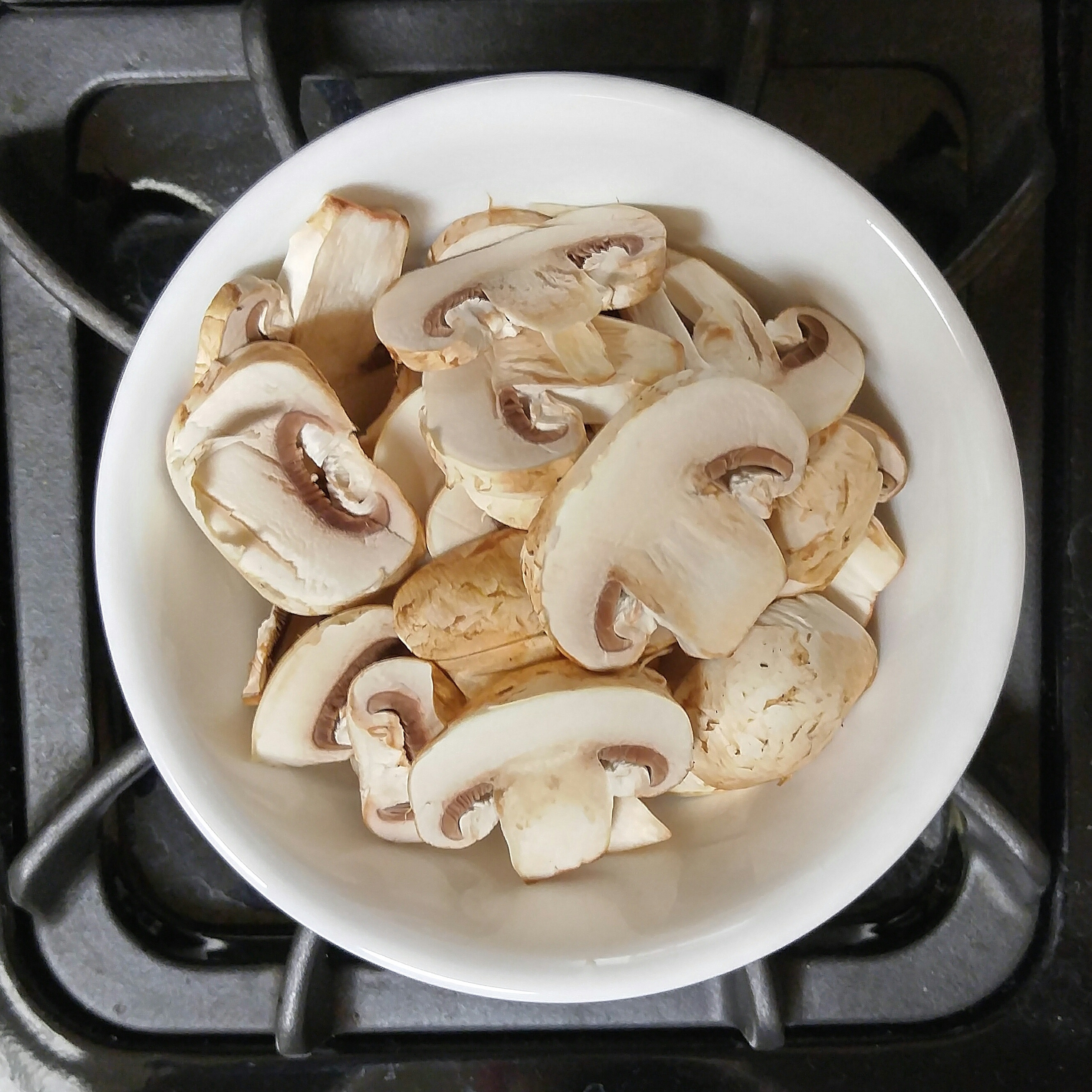 Sliced white mushrooms on a plate