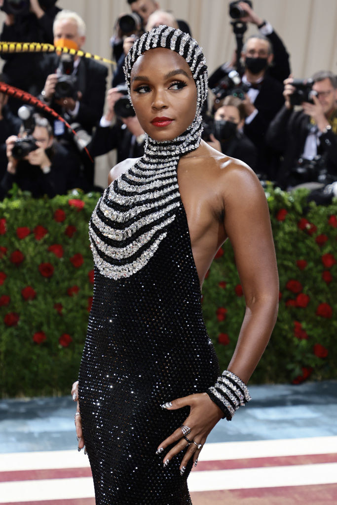 A closeup of Janelle Monae from the waist up