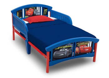 The car themed bed in blue and red