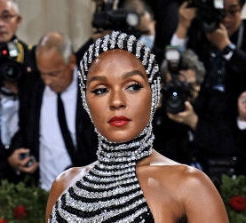 Janelle Monae in a dress that continues over her head