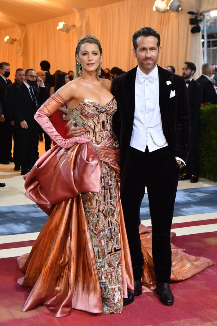 Blake Lively in a sequined gown with a train and Ryan Reynolds in a tux