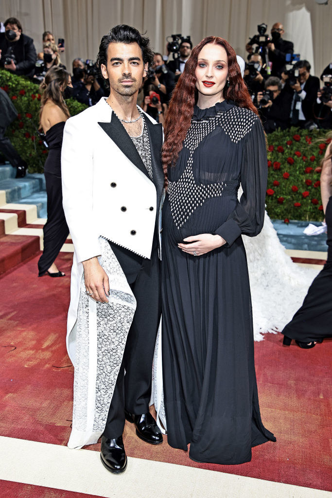 Joe Jonas and Sophie Turner stand together on the red carpet