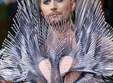Fredrik Robertsson with jeweled eye makeup and a spiky metal outfit