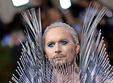 Fredrik Robertsson with jeweled eye makeup and a spiky metal outfit
