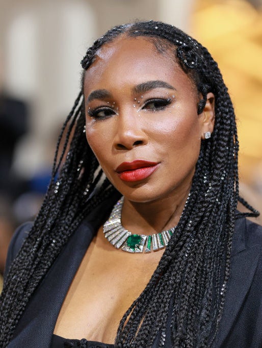 A closeup of Venus Williams that shows off her jeweled necklace, hair, and makeup