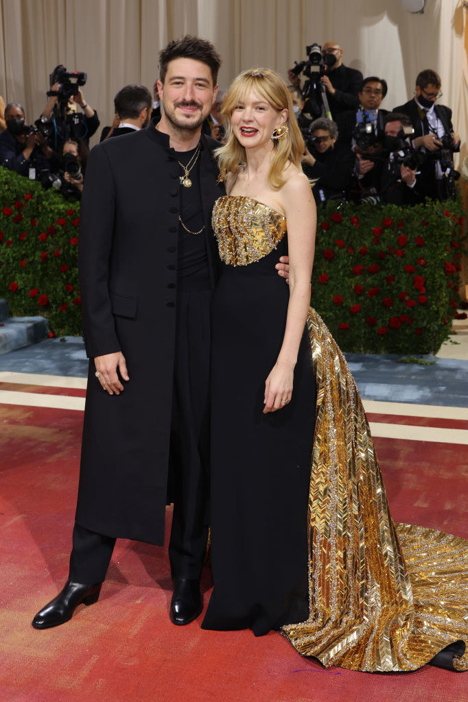 Marcus Mumford and Carey Mulligan smile together on the red carpet