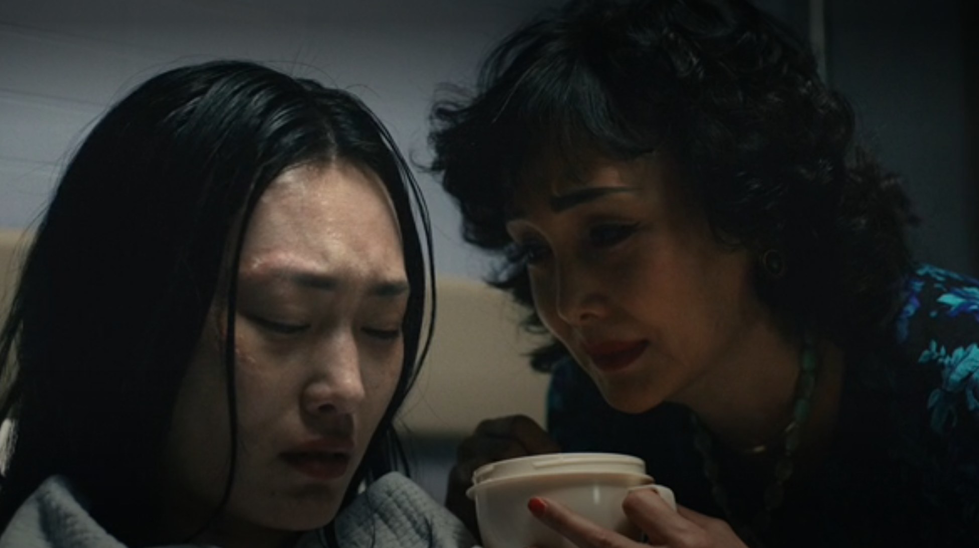 Etsuko feeding Hana as Hana cries