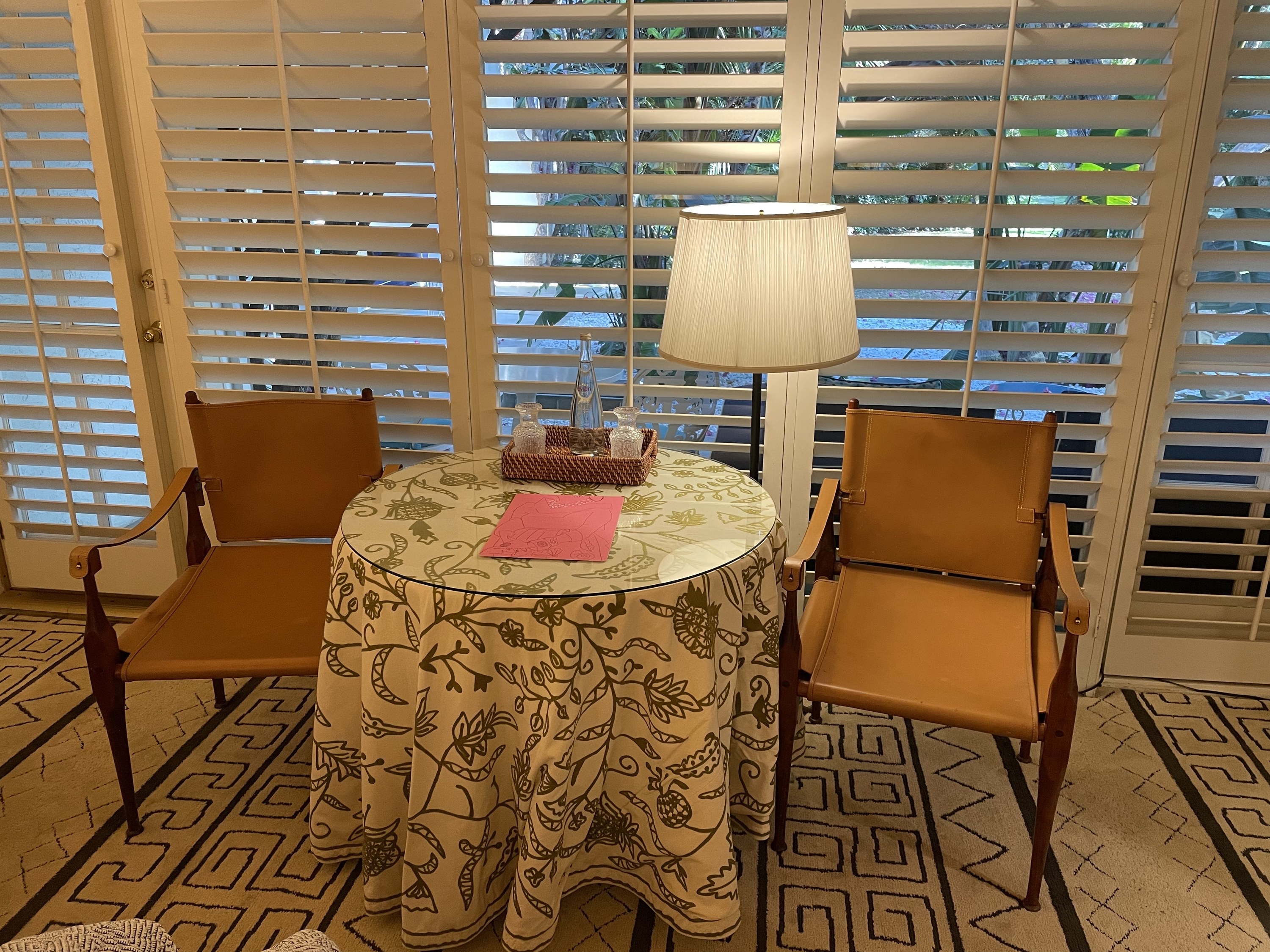 A shot of the table with chairs inside the hotel room at Parker Palm Springs
