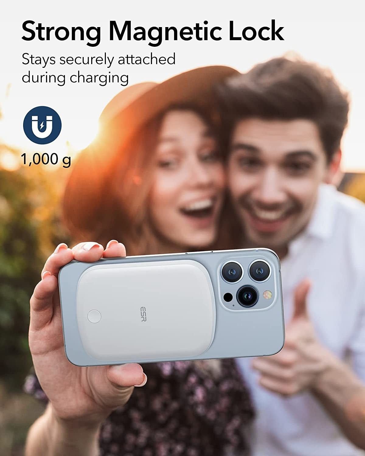 two people taking a selfie with the battery pack attached to their phone