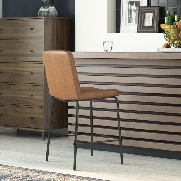 the faux leather tan-colored counter stool