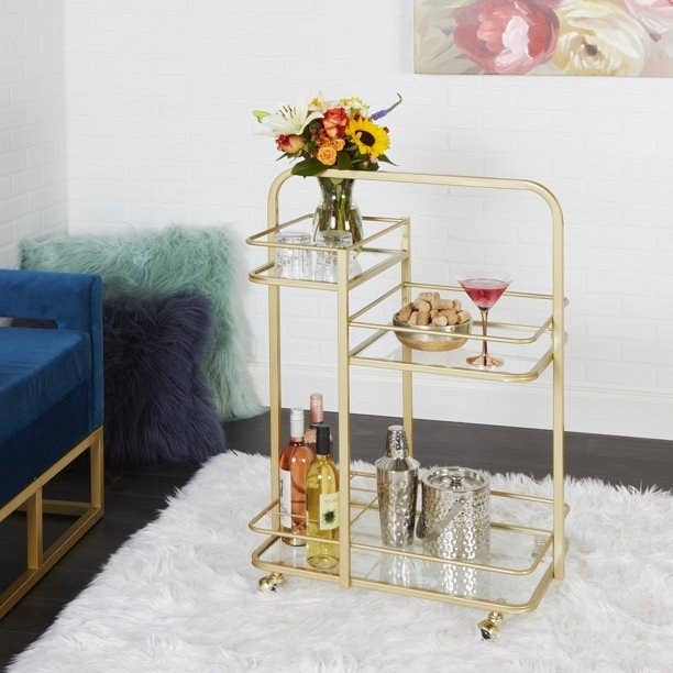 the art deco-styled bar cart in gold