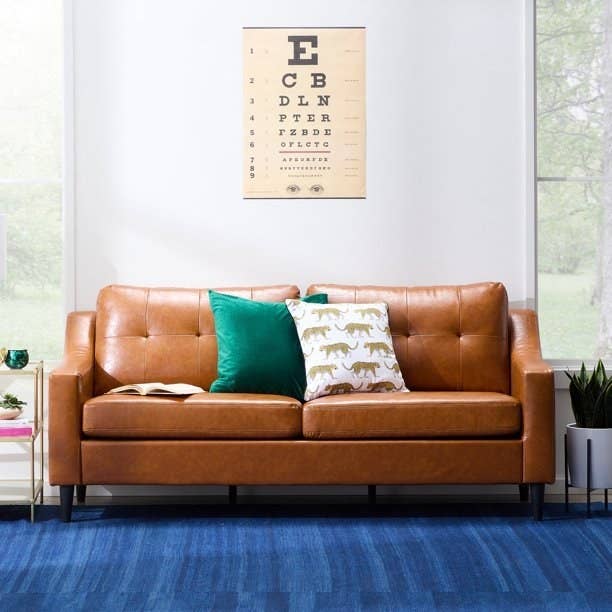 the tan-colored faux leather couch