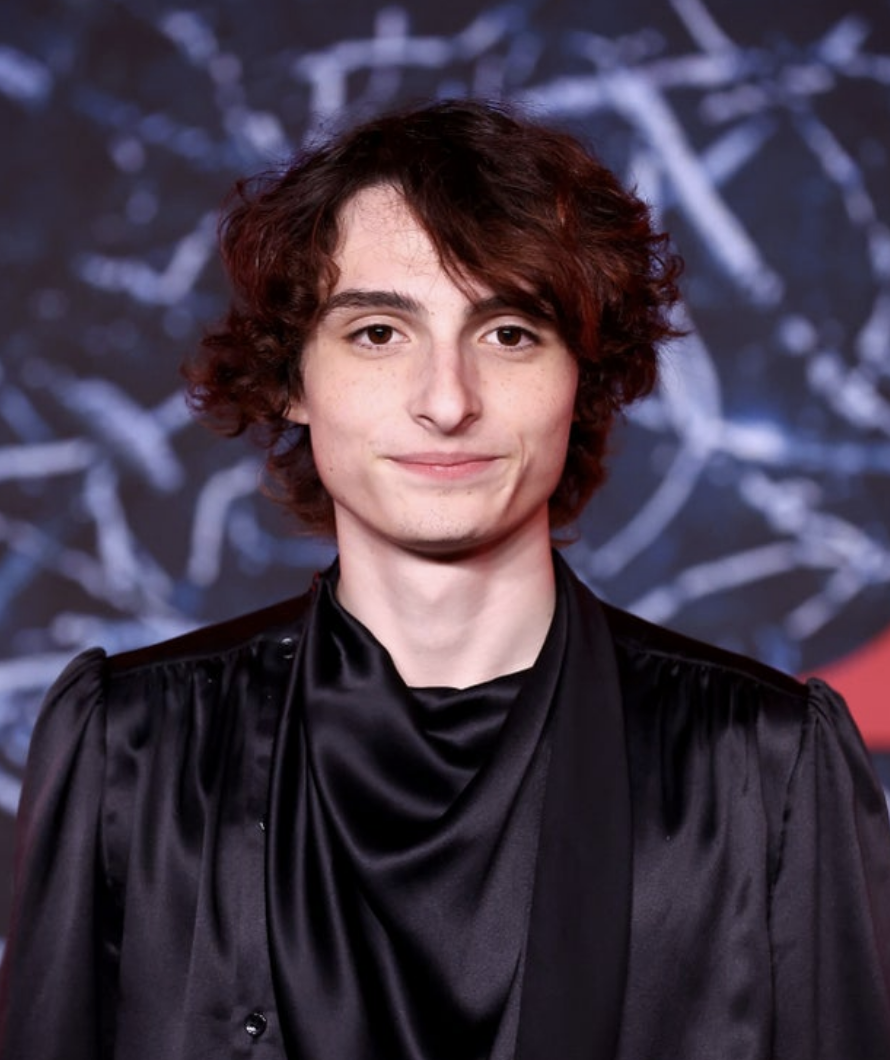 Finn in a black silk shirt at a premiere