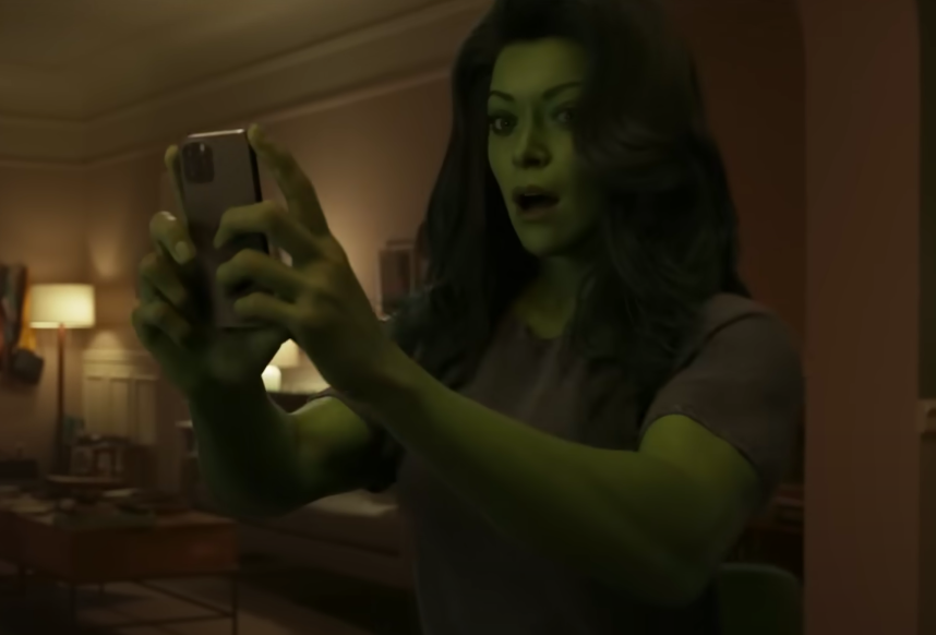 Tatiana in the movie holding up a cellphone