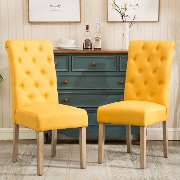the yellow tufted accent chairs