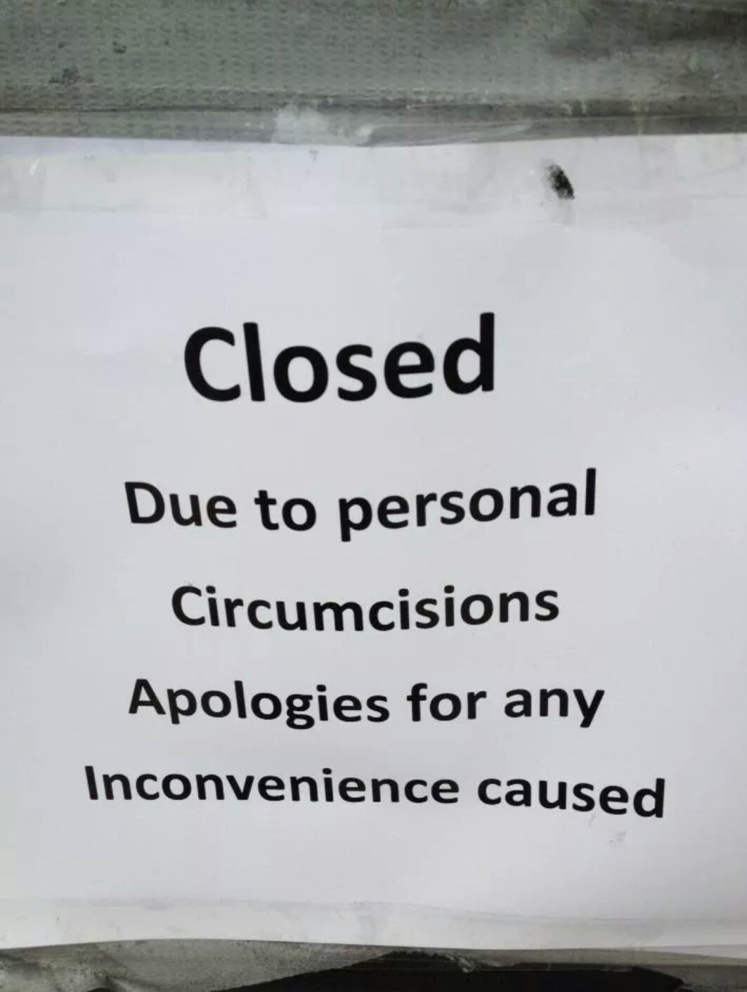 Sign reads, &quot;Closed due to personal circumcisions Apologies for any Inconvenience caused&quot;
