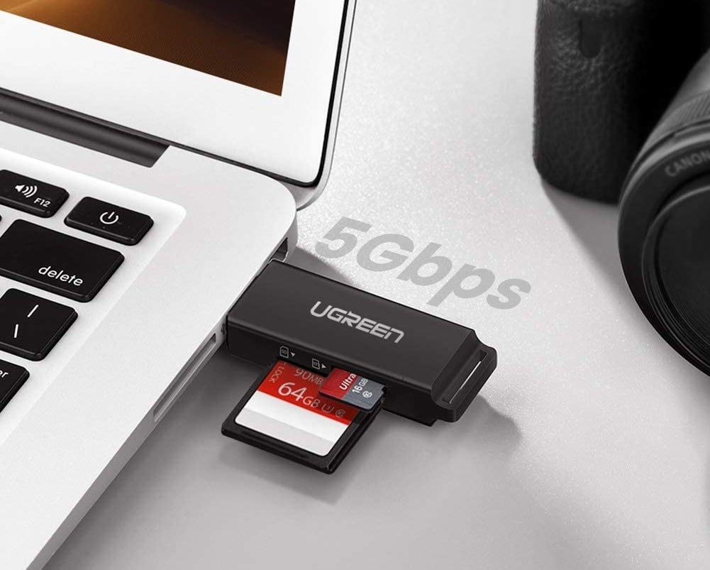 the SD card reader plugged into a laptop with cards in it