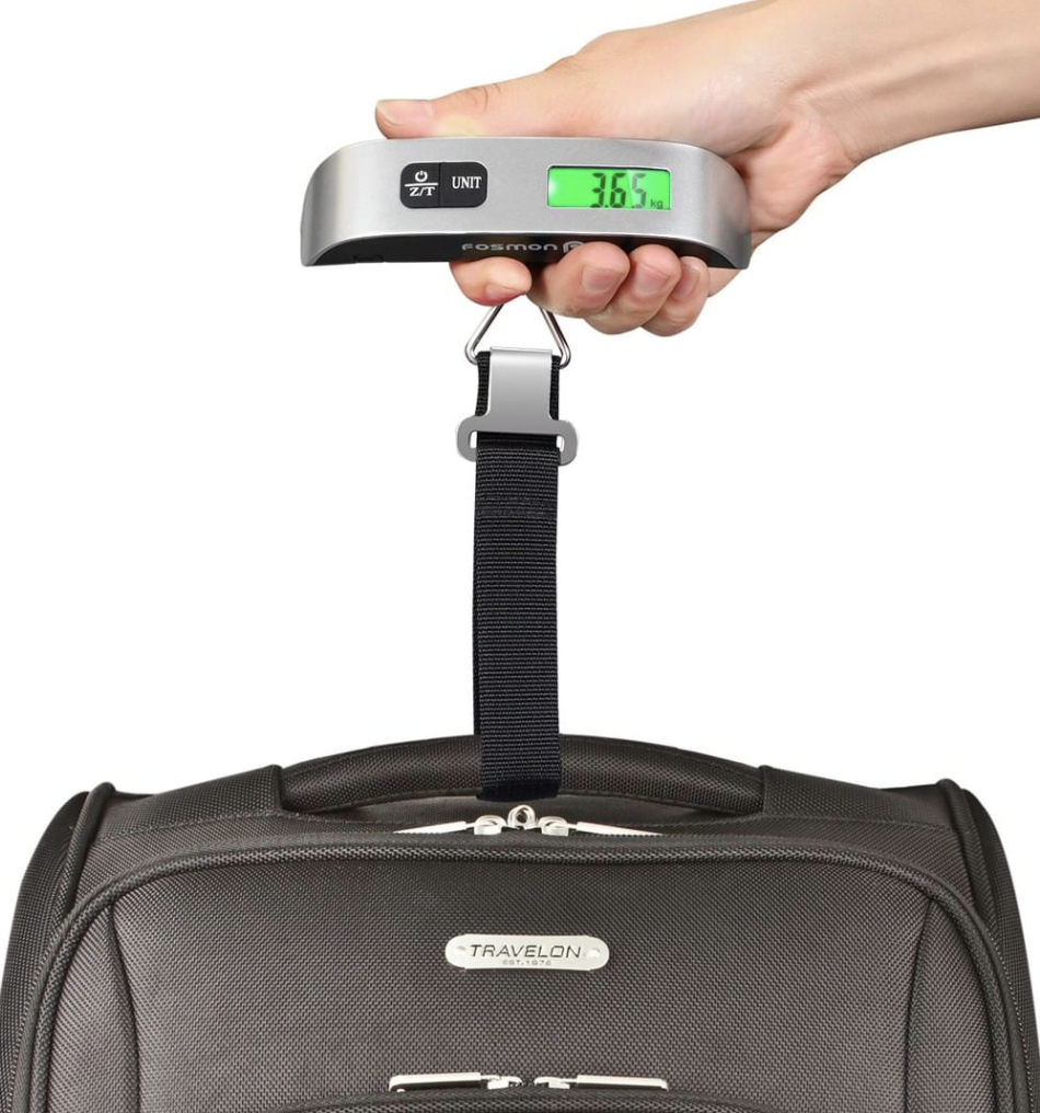 The travel scale being used on a suitcase