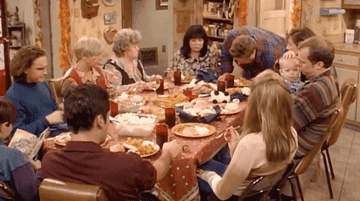 whole family sitting at the table for Thanksgiving on &quot;Roseanne&quot;