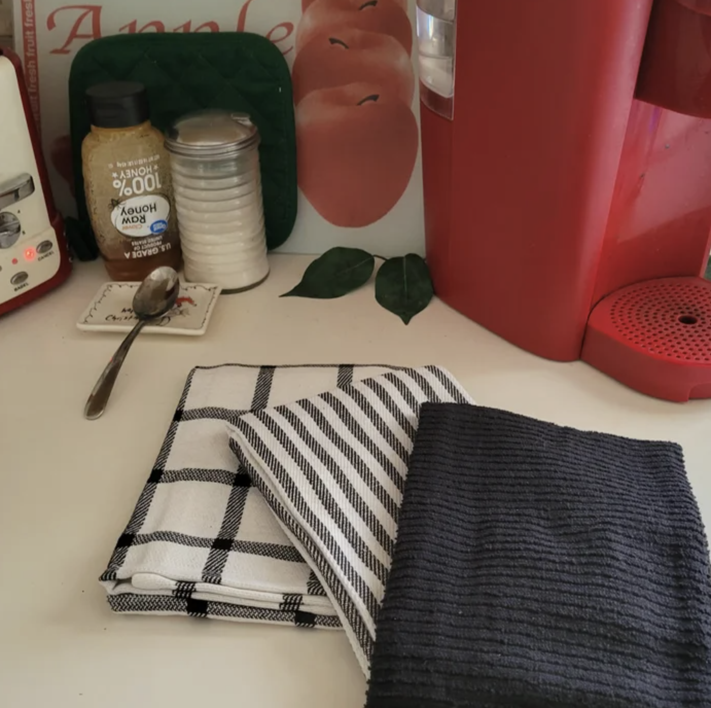 reviewer photo of the black and white towels on a counter