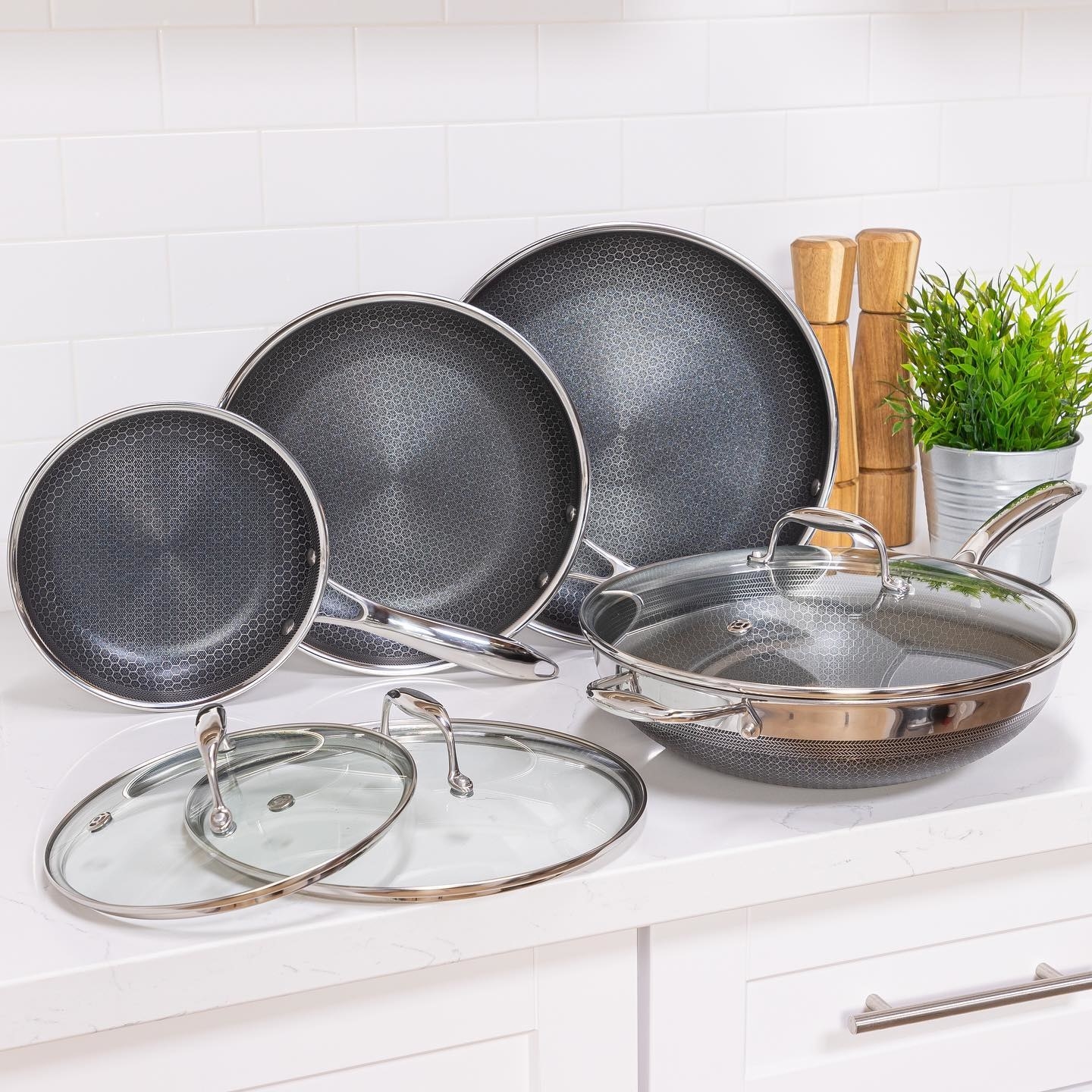 the 7-piece cookware set sitting on a kitchen counter