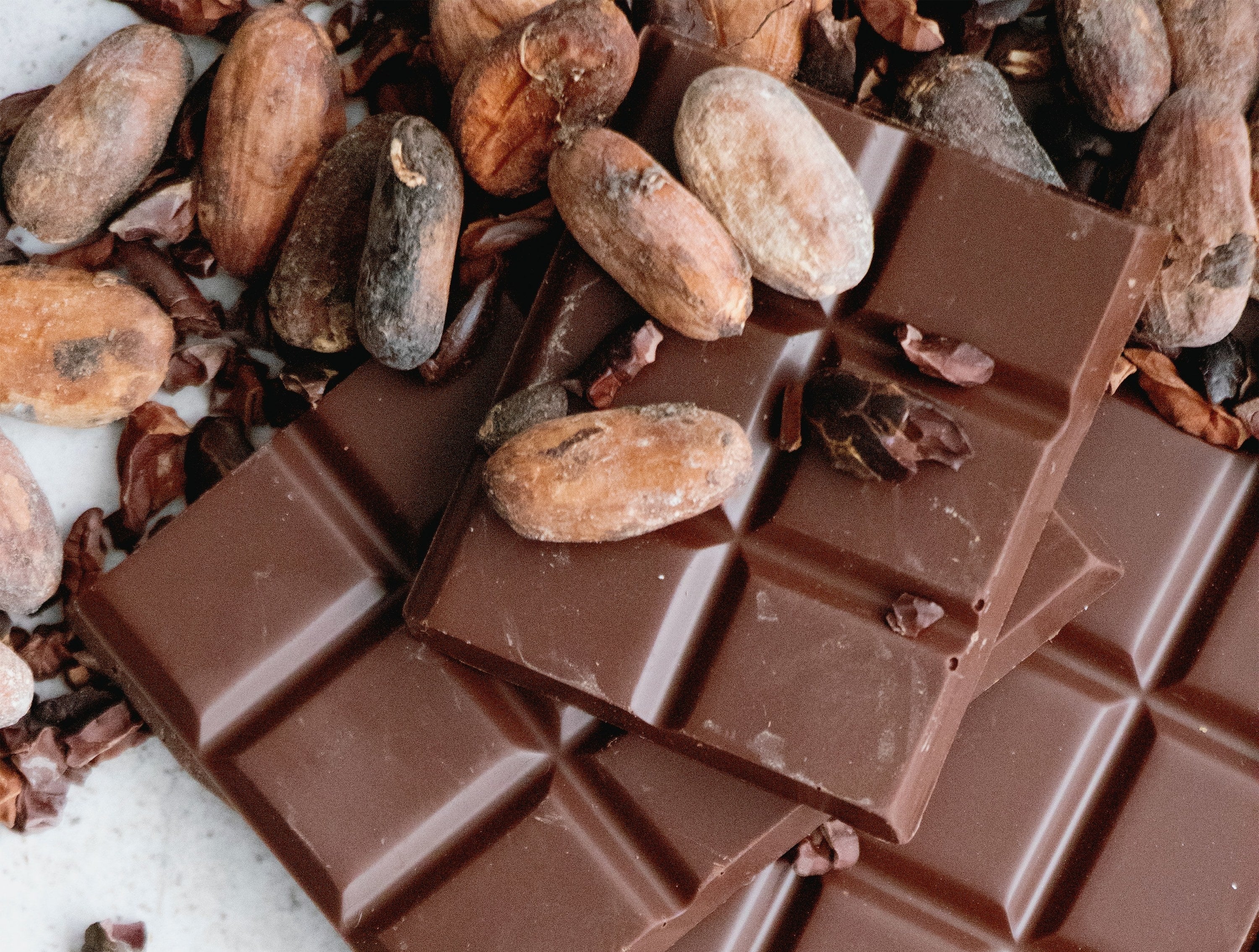 Chocolate bars and cacao beans