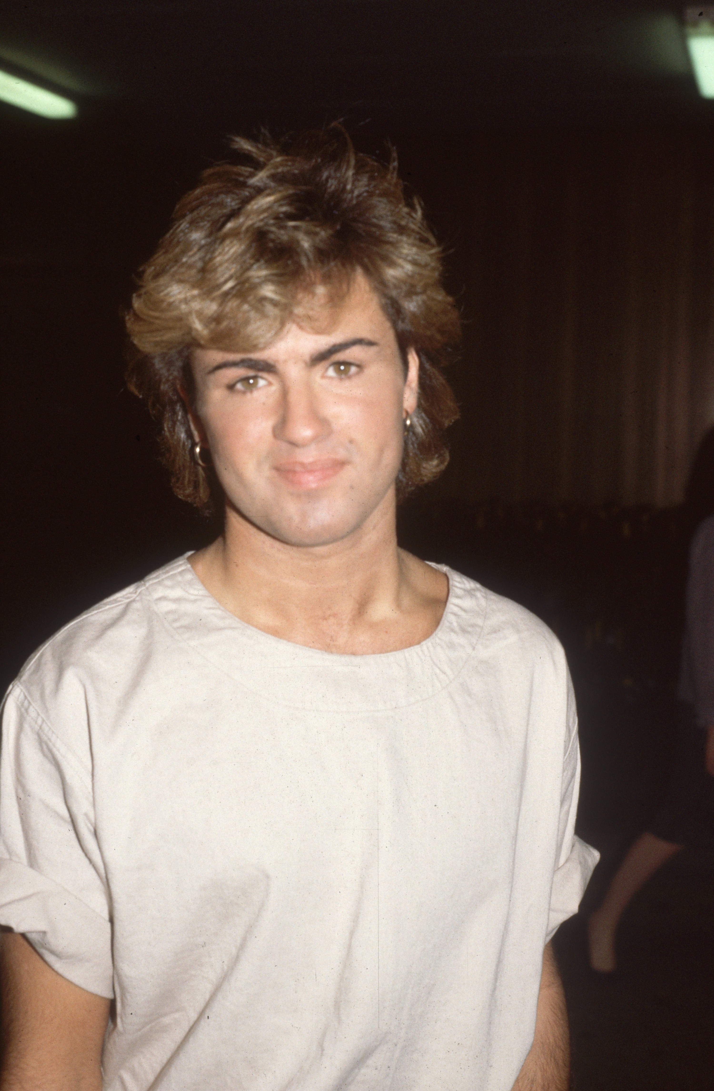 George Michael is pictured at Heathrow Airport in 1984