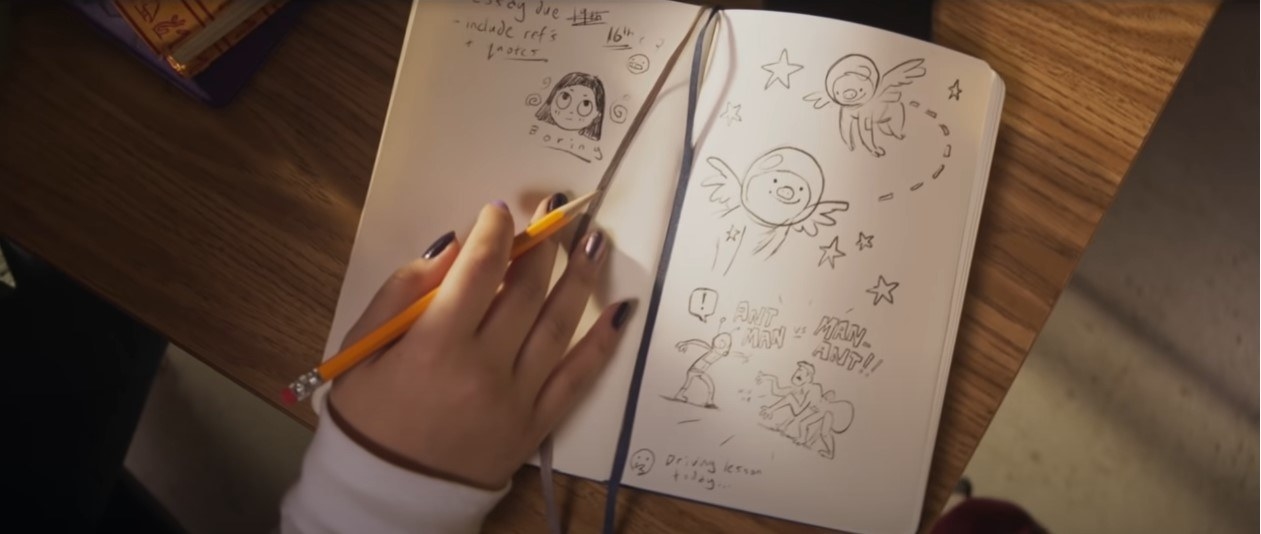 A shot of Kamala&#x27;s notebook, showing doodles of flying pigs in space, Ant-Man versus Man-Ant and scribbled notes like &quot;essay due 16th, include refs and quotes&quot; and &quot;driving lesson today&quot;
