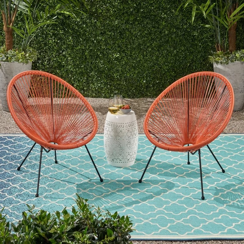 Two hammock weave chairs in orange