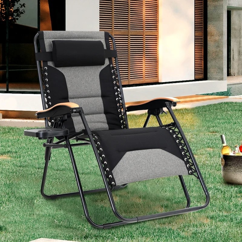A black and grey reclining zero gravity chair